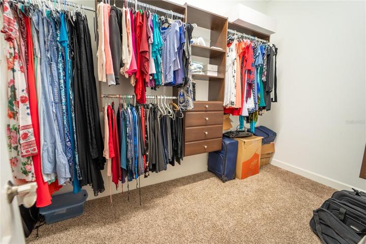 1 OF 2 PRIMARY SUITE CLOSETS...