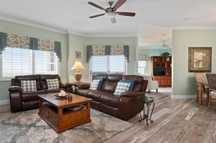 Great room looking towards den/study and to the right the dining room. Sliders to on of two lanais.