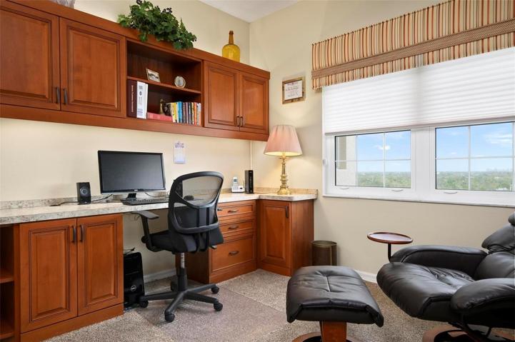 Bedroom 2 with built-in desk with granite counter