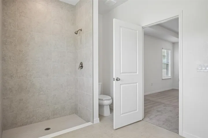 Primary Bathroom with tile shower