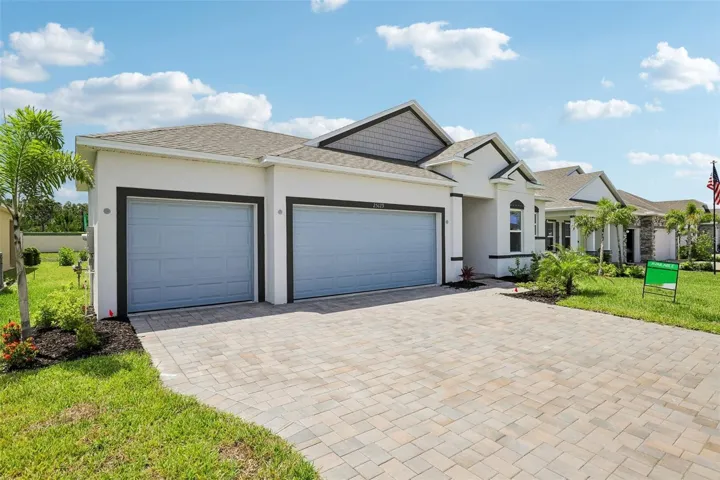 Block construction - 3 car garage, brick driveaway & entry pavers