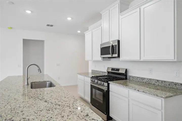 Granite Countertops, Stainless Appliances & Spacious Island