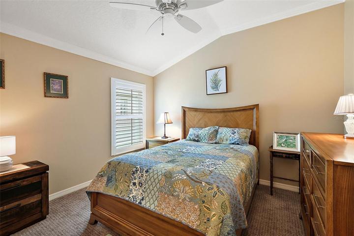 Bedroom 2 w/vaulted ceiling & plantation shutters