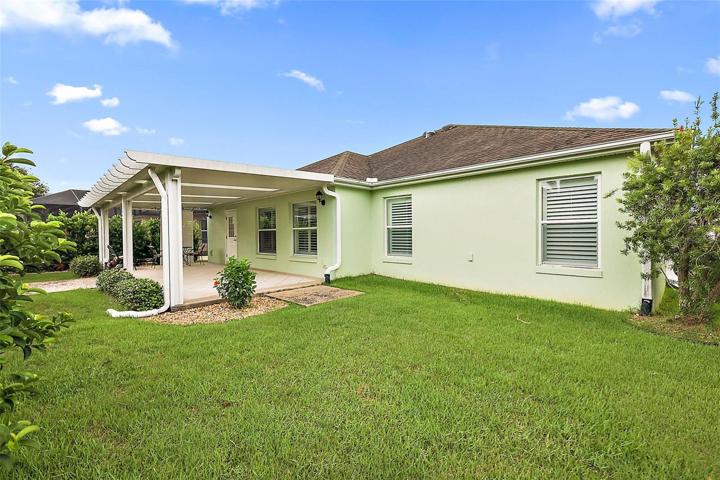 Backyard w/access to patio & enclosed lanai