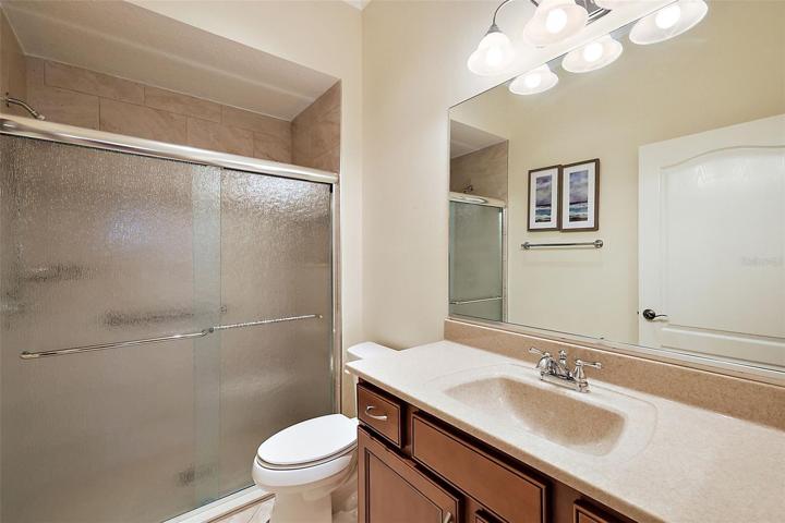 Guest bathroom w/tiled tub & shower combination