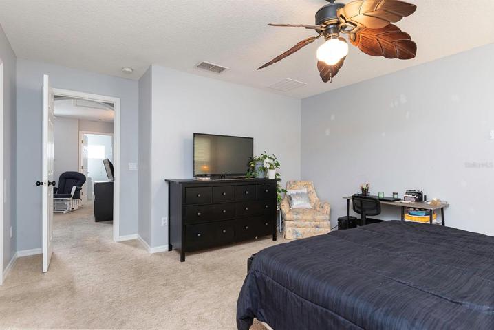 Master bedroom with bonus room beyond the door.