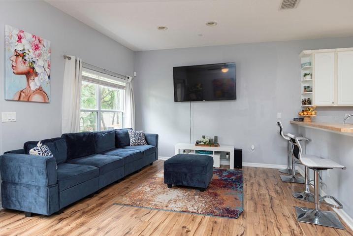 TV can be enjoyed from the living room and kitchen.