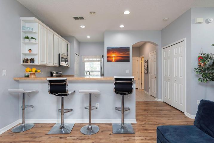 View of kitchen and entry foyer.
