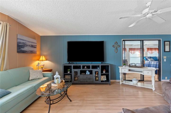 Living room is open with dining area.