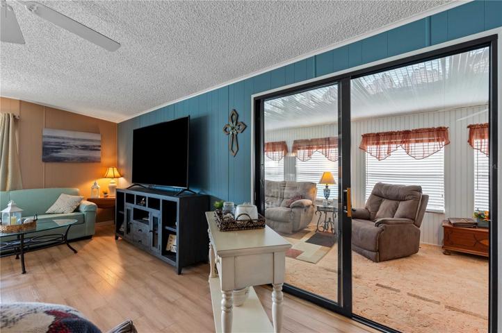 Sliding door into Florida room or a spare bedroom for vistors.