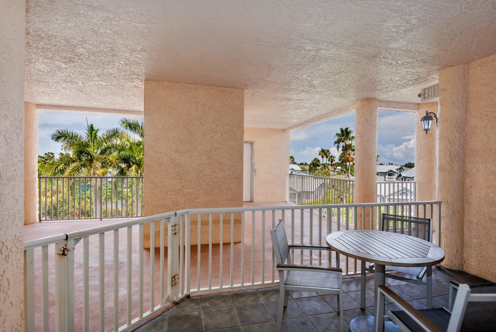 Large covered lanai with pool views and tropical breeze