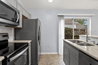 Kitchen View with Slider to Side Yard