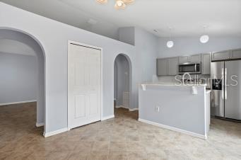 Kitchen Pantry and Archways to Living Room