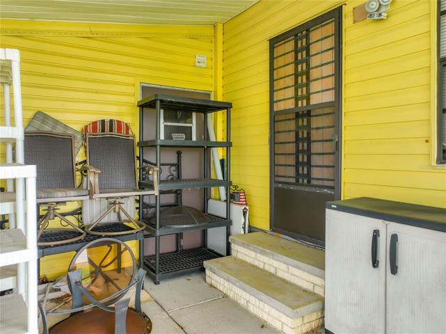 Plenty of storage space behind the home as well. This door will give access to the bonus room