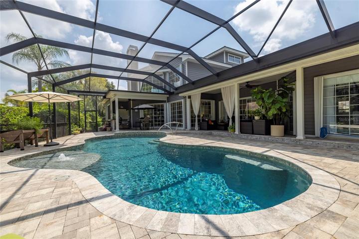Fully remodeled pool area with Pebble Tec pool, travertine and new pool enclosure