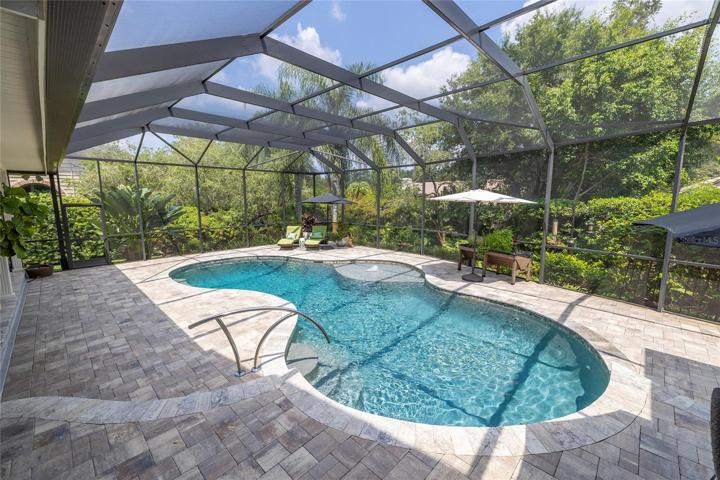 Entertain outside with remodeled Pebble Tec pool