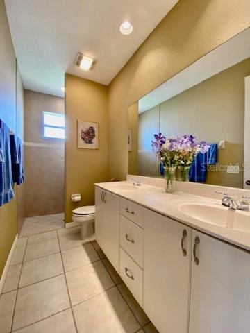 Large Guest bathroom with walk in shower, dual sinks & linen closet