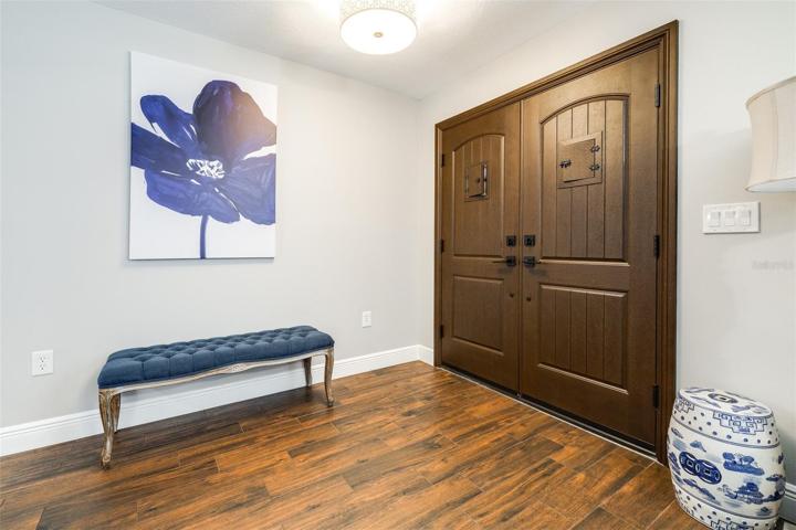 Beautiful newer front doors with a peek-a-boo window
