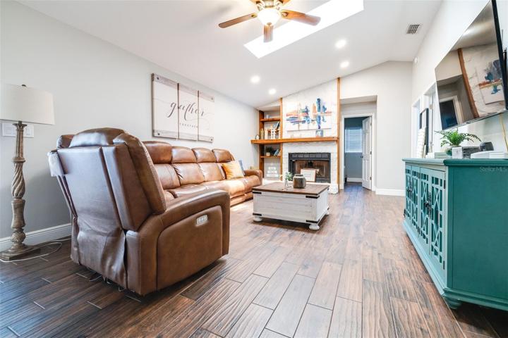 family room with wood burning fire place!