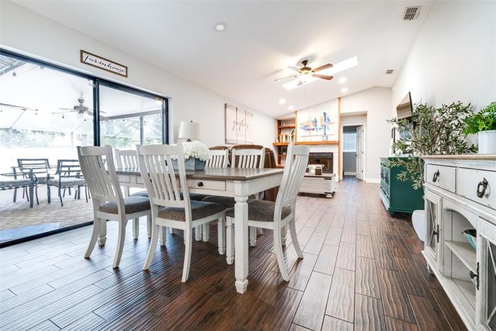 dining area has sliders out to patio/pool
