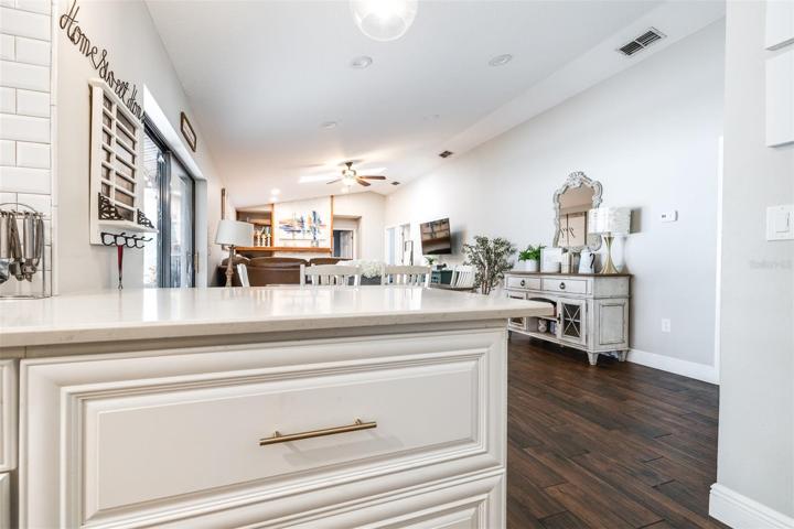 gold decorative handles on all kitchen cabinets