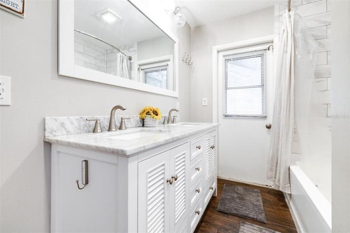 secondary bathroom with bathtub/shower combo