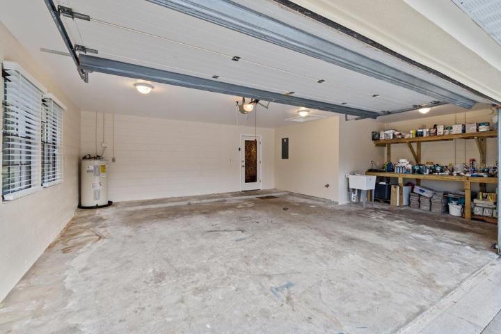 Extended two car garage Which includes an additional work area with heavy duty built-in workbench