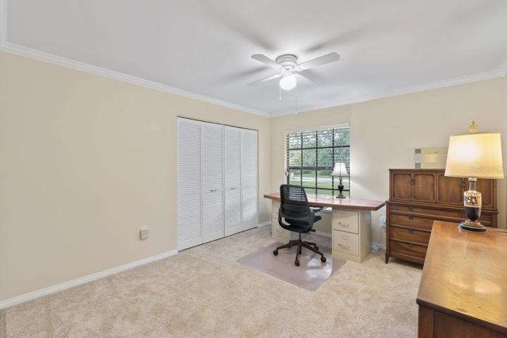 Guest bedroom #2 Featuring crown molding, and new carpet.