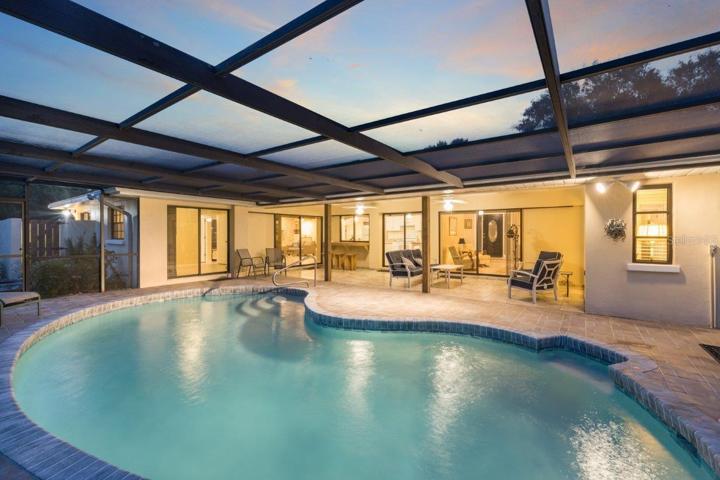 Huge Renovated Screened-in lanai with a freshly resurfaced pebble tec pool, and gorgeous views of the back yard and lake.