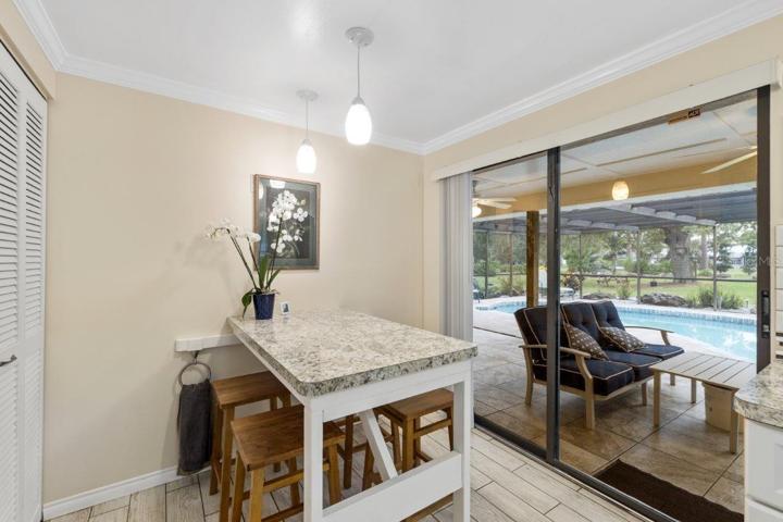Custom eat-in kitchen space with a built in table and stools.