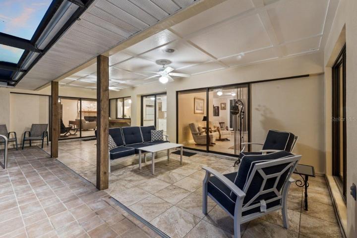 Huge Renovated Screened-in lanai with a freshly resurfaced pebble tec pool, and gorgeous views of the back yard and lake.