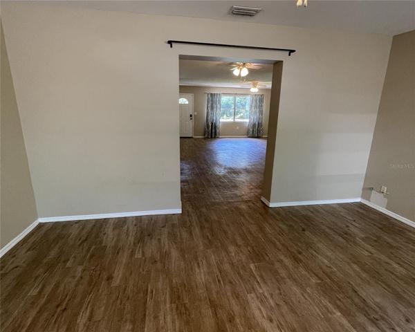 VIEW FROM FAMILY/BONUS ROOM TO LIVING/ DINING  ROOM