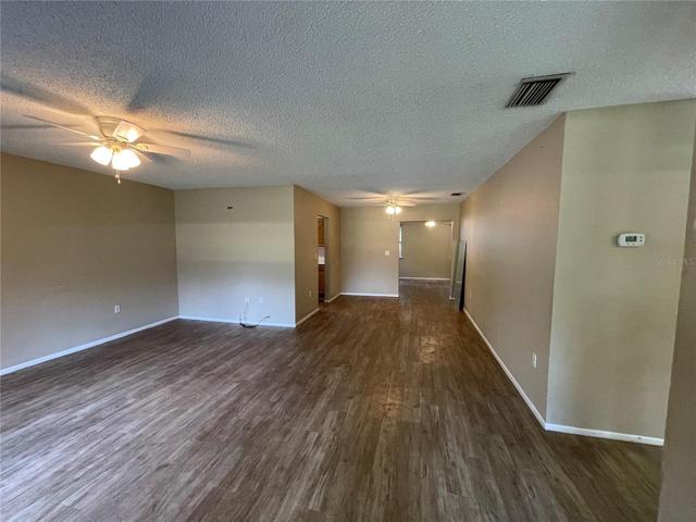 SPACIOUS LIVING AND DINING ROOM COMBO WITH VIEW TO THE FAMILY/BONUS ROOM