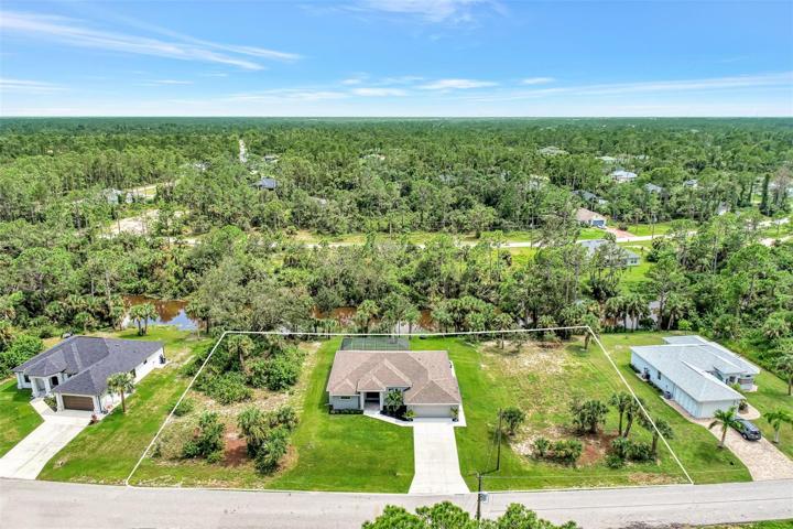 The Lot on each side is included.  The lot on the right is cleared and sodded, the lot on the right is not cleared.  All 3 lots are on the canal!