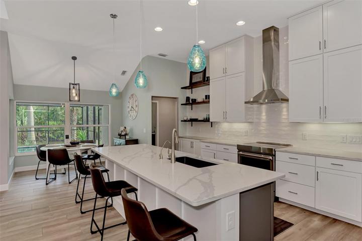 Decorative pendant lighting above the center island.