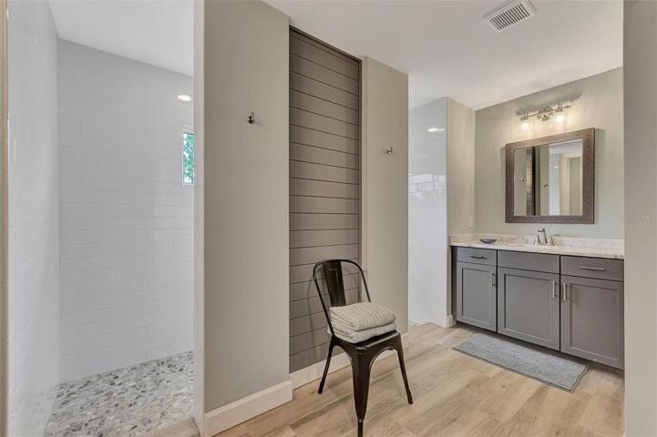 Master bath offers dual sinks and a upgraded walk-in shower that can be accessed from both sides! Both dual sinks have granite countertop.