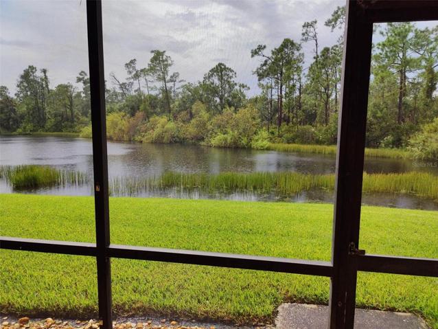 spacious screened tiled lanai with panoramic view on the lake, preserve across the lake enjoy privacy!