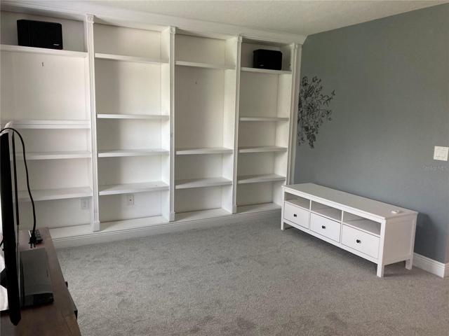 Second floor family room with lots of shelving