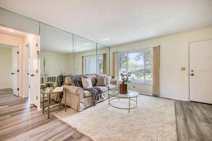 Quality luxury vinyl plank flooring in a neutral driftwood shade throughout~