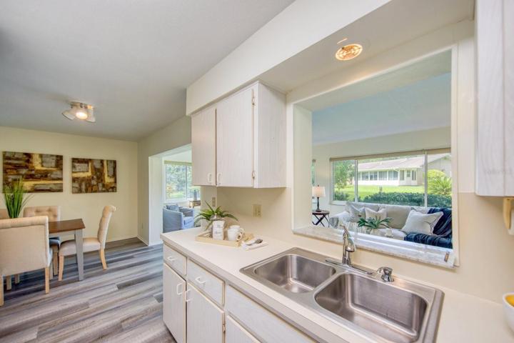 Kitchen opens to dining room & pass through shelf to family room~