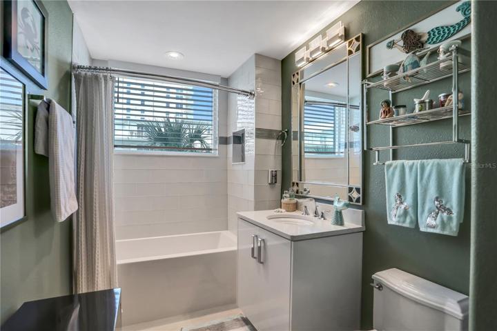 Full bathroom with soaking tub