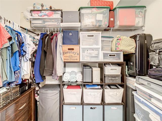 Walk in closet in owner's suite. Doorway widened to provide for wheelchair access