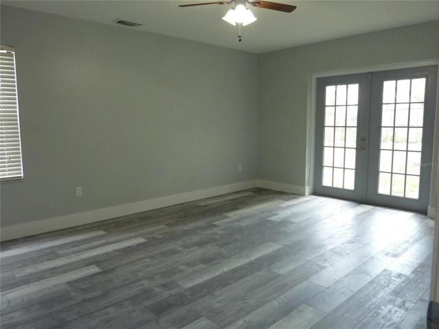 Master bedroom with french doors to back yard