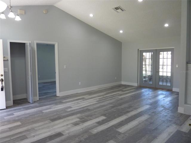 Living room with french doors to screened patio
