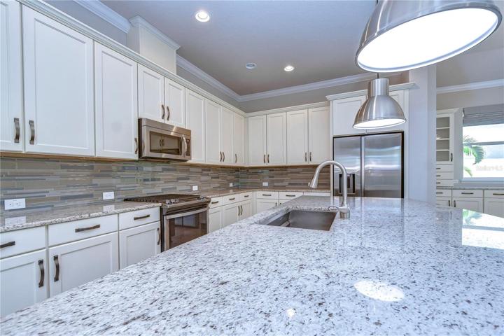 42-inch white cabinets with crown & decorative backsplash!