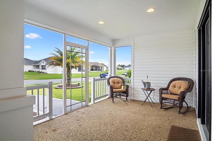 Spacious Front porch/patio is covered & screened