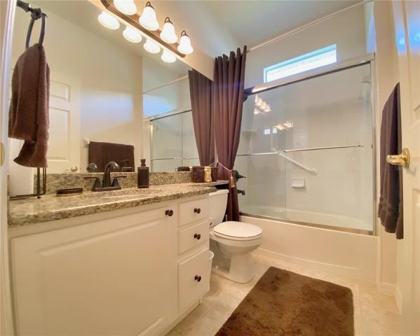 Guest Bathroom, Granite Counter Top, Glass Door Enclosure, Accent Window
