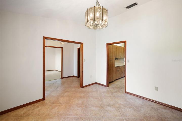 Dining room towards foyer and kitchen to the right