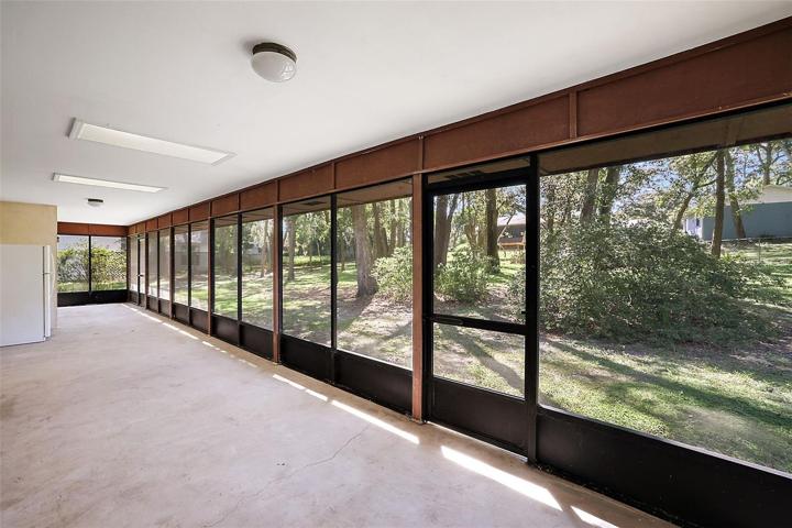 Incredible screened-in lanai with natural light from the skylights above