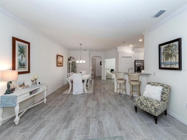 Dining area, eating bar an French doors to den/study